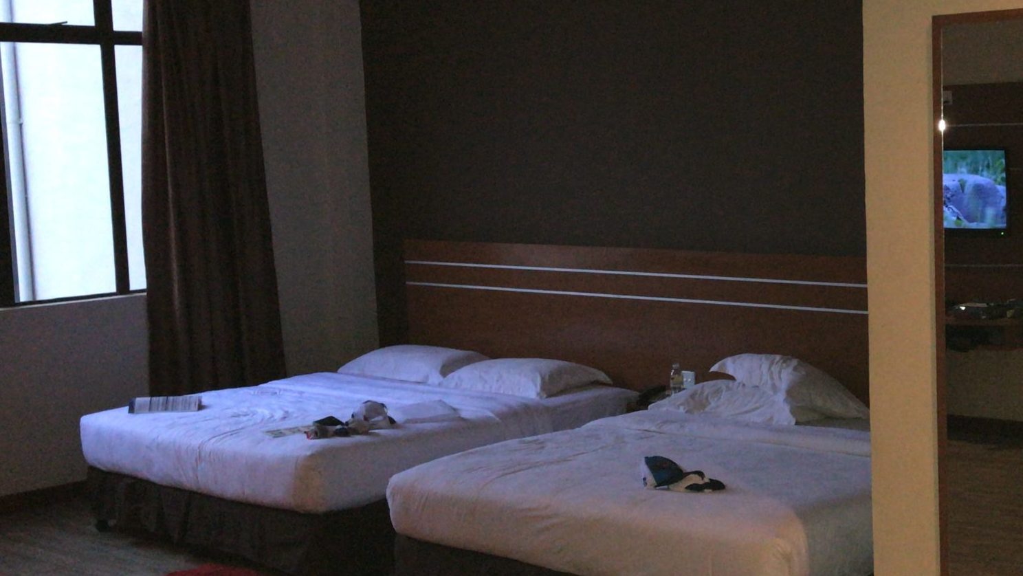 two queen size beds in a hotel room