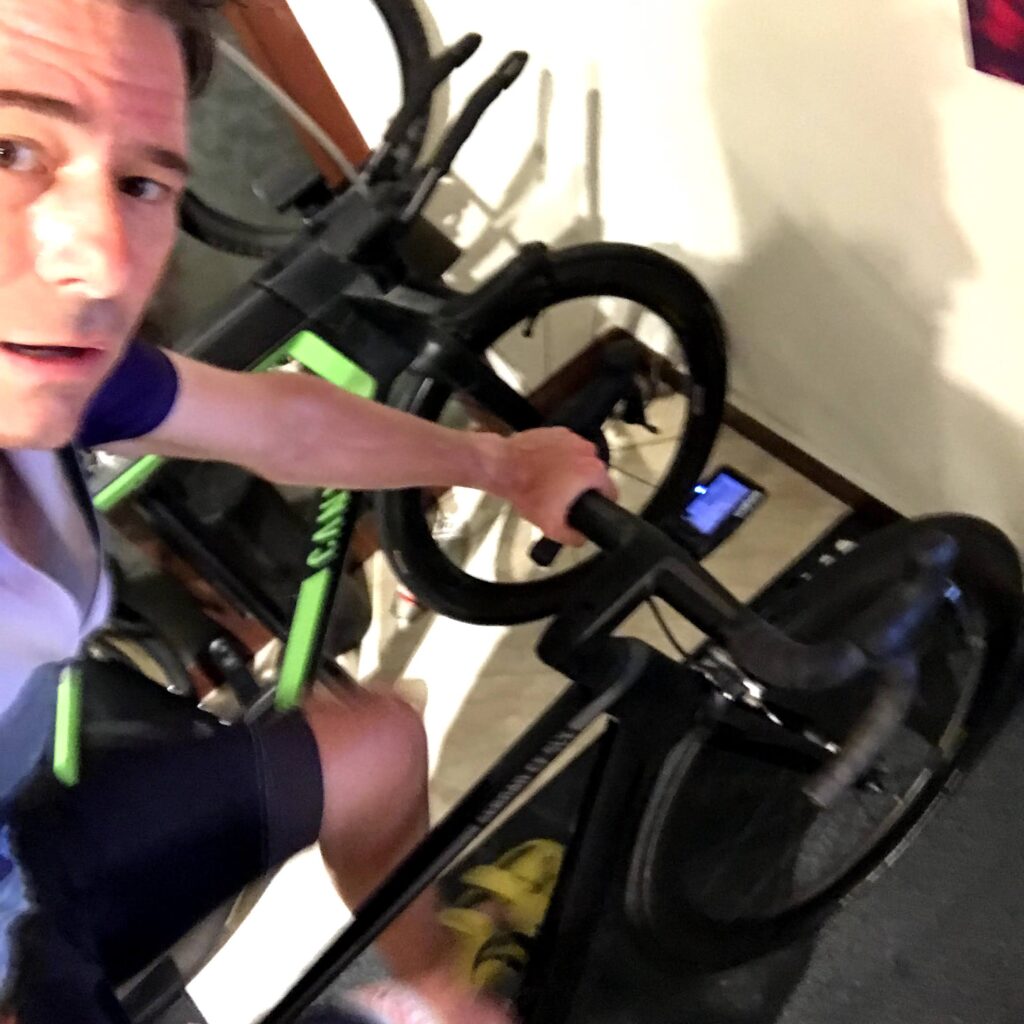 Triathlete on bike on indoor trainer